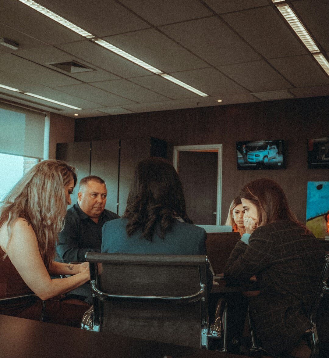 Team of magazine editors smiling together in an office
