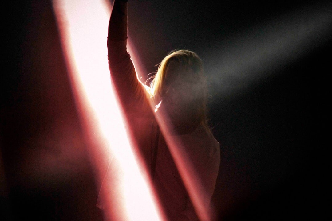 woman in spotlight on stage